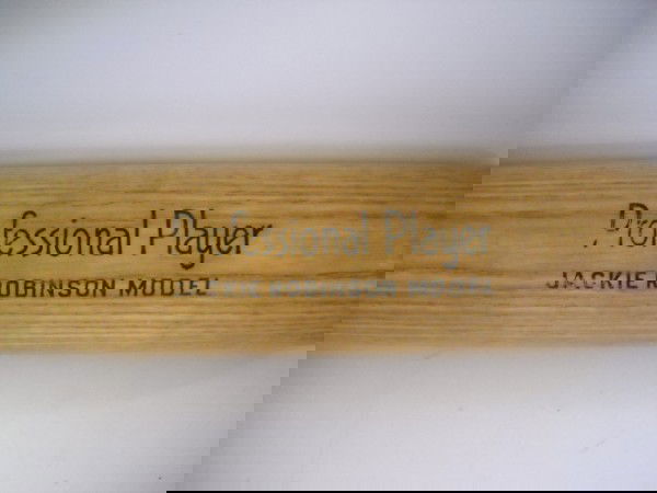 BASEBALL BAT: JACKIE ROBINSON MODEL PROFESSIONAL PLAYER PEERLESS BRAND BASEBALL BAT. USED CONDITION. 32 INCHES LONG
