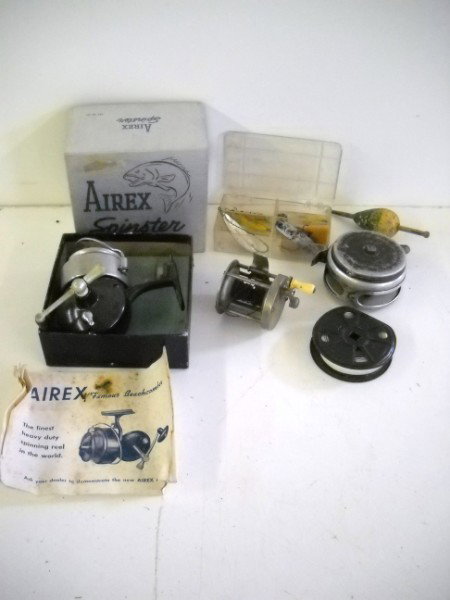 FISHING LOT: FISHING REELS INCLUDING AIREX; FLY REELS; & LURES. 7 1/2 INCHES X 6 INCHES