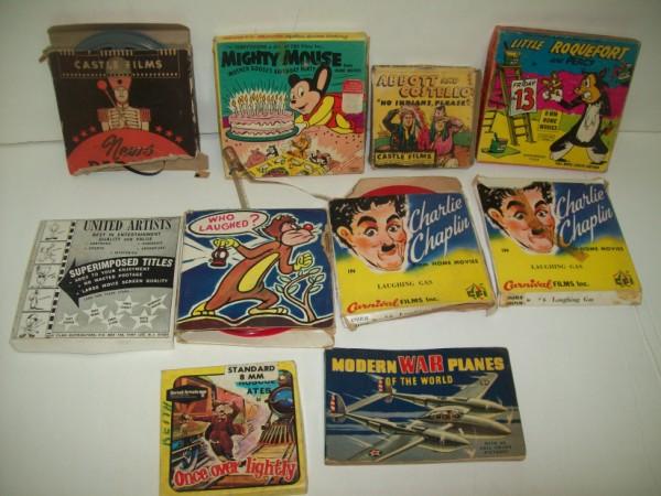 8 MM FILMS: VARIOUS 8 MM MOVIE REELS INCLUDING MIGHTY MOUSE; 2 CHARLIE CHAPLIN; ABBOTT & COSTELLO; & MODERN WAR PLANES OF THE WORLD BOOK. USED CONDITION; BOTTON OF UNITED ARTISTS BOX LACKING; BOXES TORN; STAINED.