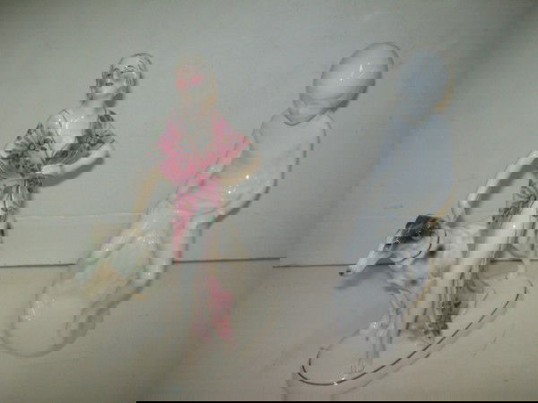 PORCELAIN STATUES: 2 PORCELAIN STATUES INCLUDING WOMAN WITH DOG; CHILD STATUE MARKED SPODE. CHIP ON DOG. 9 INCHES X 6 INCHES