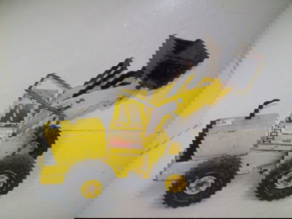 TONKA TRUCK: TONKA TURBO- DIESEL BULL DOZER. USED CONDITION; RUST; PAINT LOSS; SCRATCHES; LABEL PEELING. 19 INCHES X 10 INCHES.