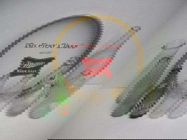 BOTTLES: COLLECTION OF ASSORTED GLASS ADVERTISING BOTTLES INCLUDING 7UP; COCA COLA; ROBERTS GLASS BOTTLE WITH MARBLE IN TOP; & MILLER BEER TIN ADVERTISING SERVING TRAY. USED CONDITION; SCRATCHES. 13 INCHES DIA