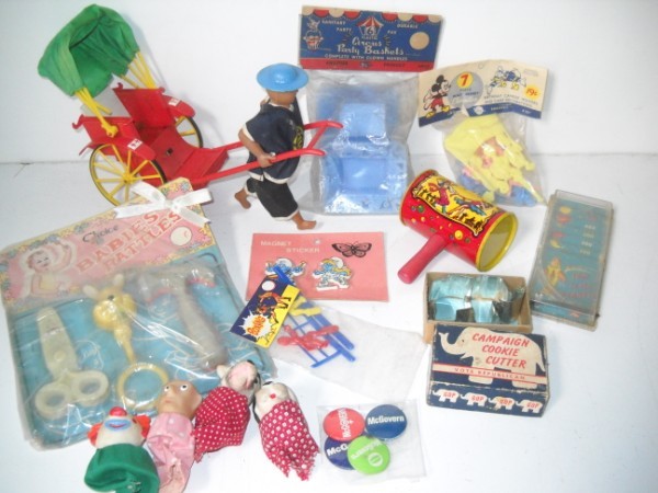 TOYS: TOYS INCLUDE FINGER PUPPETS; GOP COOKIE CUTTER; BABY RATTLES. USED CONDITION; LACKING BATTERY COVER. ALL SALES ARE FINAL, ITEMS ARE SOLD "AS IS". FOR COMPLETE CONDITION REPORT CONTACT AUCTION HOUSE BY