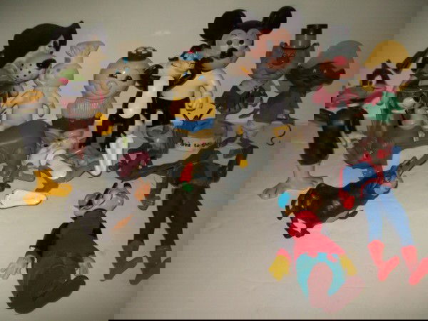 FIGURES: COLLECTION OF RUBBER/PLASTIC FIGURES INCLUDING MICKEY MOUSE BANK; DUMBO; BUGS BUNNY; SPIDERMAN; YOGI BEAR. STAINS; BULL FOOT NOT ATTACHED; PAINT LOSS. LARGEST MEASURES 12 INCHES HIGH. ALL SALES ARE FI