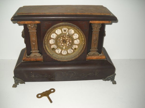 MANTLE CLOCK: SETH THOMAS MANTLE CLOCK. USED CONDITION; SCRATCHES; LACKING BACK PANEL; CHIPS. 15 1/2 INCHES WIDE X 11 INCHES HIGH X 6 INCHES DEEP. All property is sold "AS IS", "WHERE IS", and ALL SALES ARE FINAL.