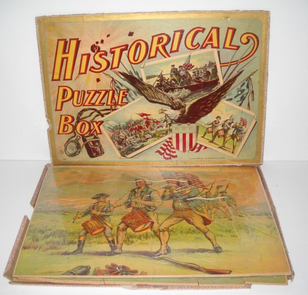 PUZZLES: HISTORICAL PUZZLE BOX INCLUDING 3 PUZZLES IN ORIGINAL BOX BY MILTON BRADLEY CO. 1 PUZZLE LACKING 1 PIECE. BOX EDGES LACKING. 18 1/2 INCHES X 13 INCHES. All property is sold "AS IS", "WHERE IS", and AL