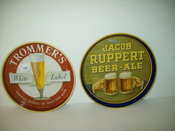SERVING TRAYS: 2 BEER ADVERTISING SERVING TRAYS INCLUDING JACOB RUPPERT BEER-ALE; TROMMER'S WHITE LABEL. SCRATCHES; PAINT LOSS. 12 INCHES X 1 INCH. All property is sold "AS IS", "WHERE IS", and ALL SALES ARE FINAL. 