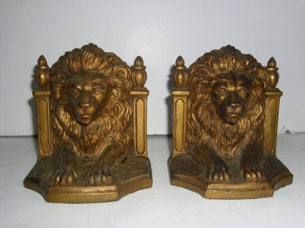 BOOKENDS: PAIR OF LION BOOKENDS MARKED JB 2145 PAT. APPL'D FOR. PAINT LOSS; SCRATCHES. 4 1/2 INCHES WIDE X 4 1/2 INCHES WIDE. All property is sold "AS IS", "WHERE IS", and ALL SALES ARE FINAL. There are NO REFU