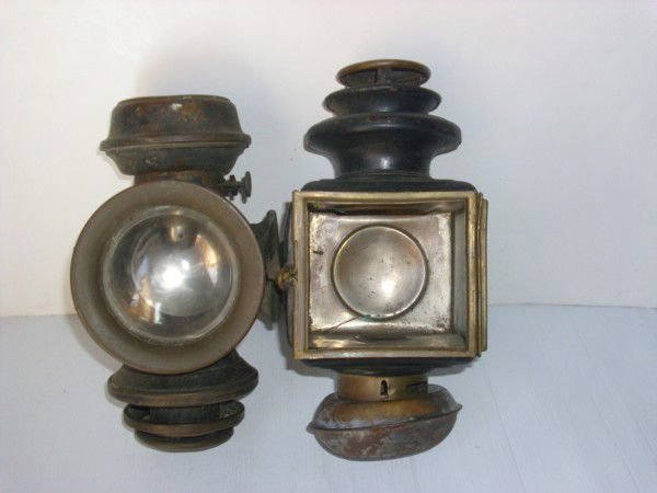 LAMPS: 2 EARLY CAR/BICYCLE LAMPS. LACKING PIECES; RUST; DENTS. 11 INCHES HIGH X 5 1/2 INCHES WIDE. All property is sold "AS IS", "WHERE IS", and ALL SALES ARE FINAL. There are NO REFUNDS, NO EXCHANGES. ALL A