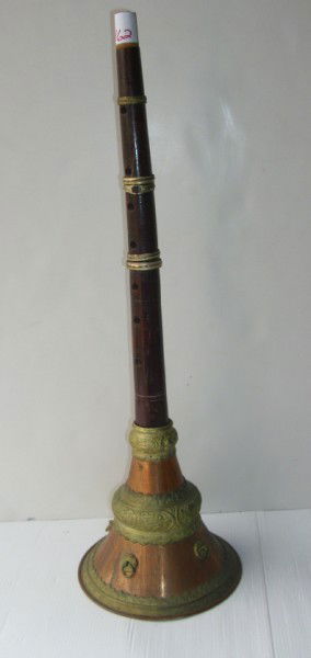 MUSICAL INSTRUMENT: WOOD FLUTE WITH COPPER/BRASS BASE. SCRATCHES; LACKING MOUTH PIECE. 21 1/2 INCHES HIGH X 7 INCHES WIDE. All property is sold "AS IS", "WHERE IS", and ALL SALES ARE FINAL. There are NO REFUNDS, NO EXCHA