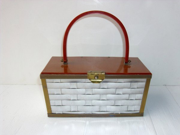 HANDBAG: DORSET REX WOVEN METAL & LUCITE STYLE HANDBAG. SCRATCHES. All property is sold "AS IS", "WHERE IS", and ALL SALES ARE FINAL. There are NO REFUNDS, NO EXCHANGES. ALL ARTWORK, PAINTINGS, ENGRAVINGS, LIT