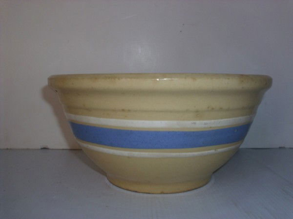 YELLOWARE BOWL: WATT YELLOWARE MIXING BOWL. HAIRLINE CRACK; CHIP. 4 INCHES HIGH X 8 1/2 INCHES WIDE. All property is sold "AS IS", "WHERE IS", and ALL SALES ARE FINAL. There are NO REFUNDS, NO EXCHANGES. ALL ARTWORK,
