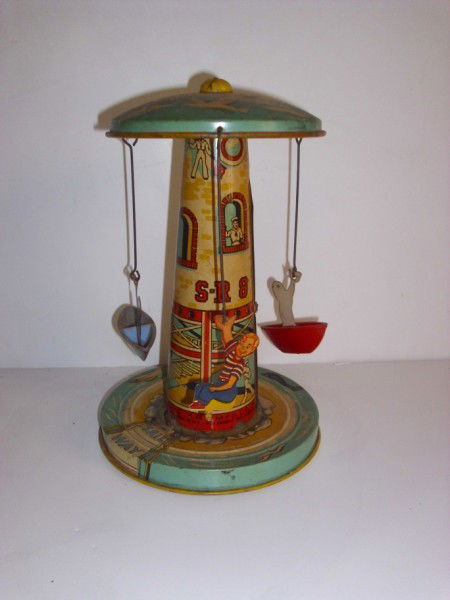 TIN TOY: 1960'S SAIL WAY TIN TOY BY UNIQUE ART MFG. CO. INC. LACKING 1 BOAT; SCRATCHES; RUST; PAINT LOSS. 9 INCHES HIGH X 9 INCHES WIDE. PLEASE CONTACT AUCTION HALL REGARDING COMPLETE CONDITION REPORT PRIOR TO