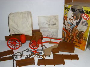 TOY: 1975 GABRIEL LONE RANGER PRAIRIE WAGON 4 IN 1 TOY IN ORIGINAL BOX WITH INSTRUCTION MANUAL. SOME PARTS NEED REPAIR. INSTRUCTION MANUAL STAINED; TEAR. 15 1/2 INCHES HIGH X 10 1/2 INCHES WIDE X 9 INCHES 