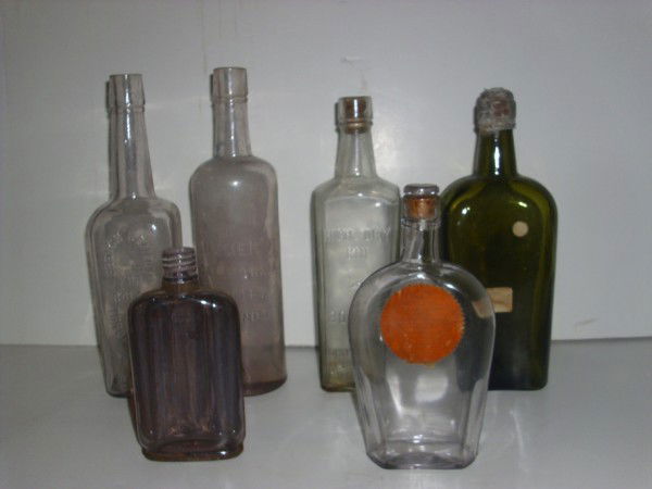 BOTTLES: COLLECTION OF BOTTLES INCLUDING BREWERS & BOTTLERS SUPPLY CO. CIGAR FLASK; GREEN WHITEHORSE; HICH & DRY GIN BOOTH'S; HOMER'S CALIFORNIA GINGER BRANDY; FRENCH REMEDY FOR COLDS. USED CONDITION; STAINS;