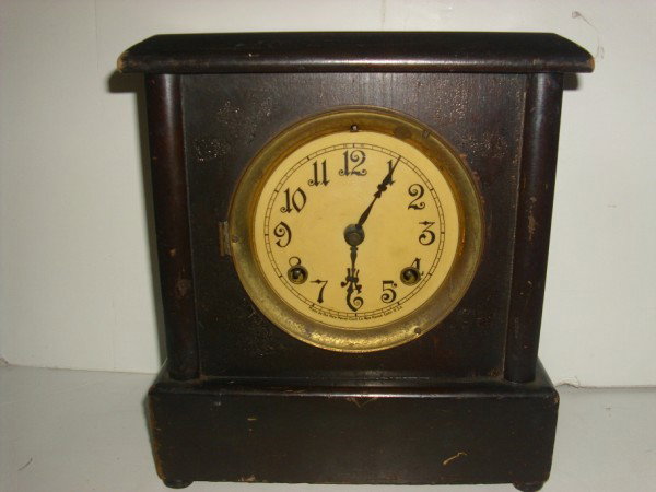 MANTLE CLOCK: MANTLE CLOCK MADE BY THE NEW HAVEN CLOCK CO. NEW HAVEN CONN. NO GLASS COVER; SCRATCHES; LACKING BLACK PANEL. 11 INCHES HIGH X 10 INCHES WIDE X 5 1/2 INCHES DEEP. All property is sold "AS IS", "WHERE I