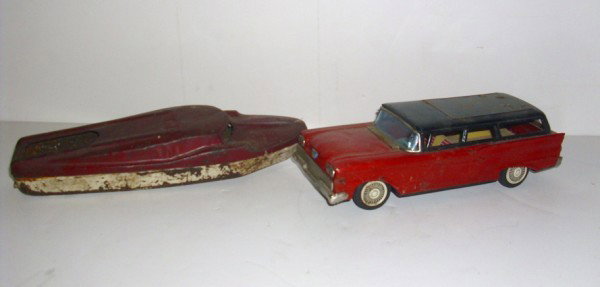 TOY: TOY CAR & BOAT. RUST; SCRATCHES; PAINT LOSS. 9 INCHES WIDE X 2 1/2 HIGH. All property is sold "AS IS", "WHERE IS", and ALL SALES ARE FINAL. There are NO REFUNDS, NO EXCHANGES. ALL ARTWORK, PAINTINGS, 