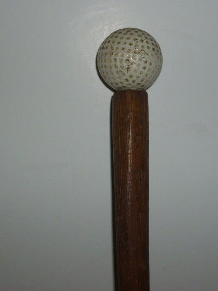 CANE: WOOD CANE WITH GOLF BALL HANDLE. USED CONDITION. 40 INCHES HIGH. All property is sold "AS IS", "WHERE IS", and ALL SALES ARE FINAL. There are NO REFUNDS, NO EXCHANGES. ALL ARTWORK, PAINTINGS, ENGRAVIN