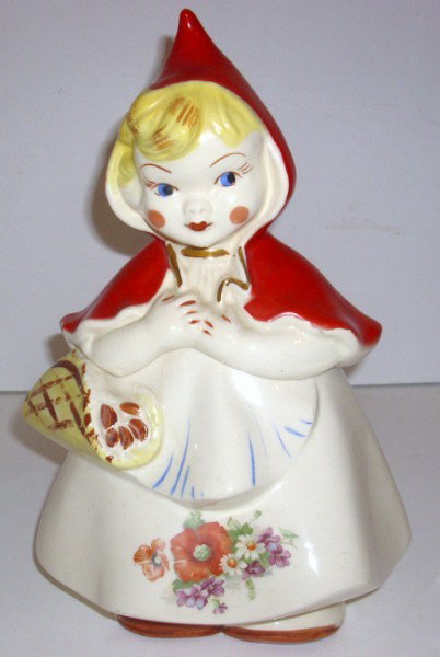 COOKIE JAR: ORIGINAL HULL LITTLE RED RIDING HOOD COOKIE JAR. BOTTOM READS : 967, HULL WARE, LITTLE RED RIDING HOOD, PATENT APPLIED FOR U.S.A. CHIP ON ONE SIDE; FADING; PAINT LOSS; STAIN ON BACK. 13 INCHES HIGH X 
