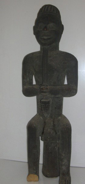 AFRICAN STATUE: LARGE AFRICAN FERTILITY WOOD STATUE. OLD STAPLE REPAIR. LACKING FOOT. 35 1/2 INCHES HIGH X 8 INCHES WIDE.