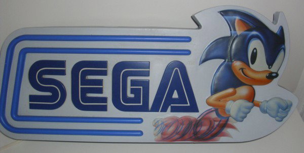 LIGHTED GAME SIGN: SEGA SONIC THE HEDGE HOG LIGHTED PLASTIC SIGN. TEAR ON EDGE. 30 INCHES X 13 INCHES X 5 INCHES.