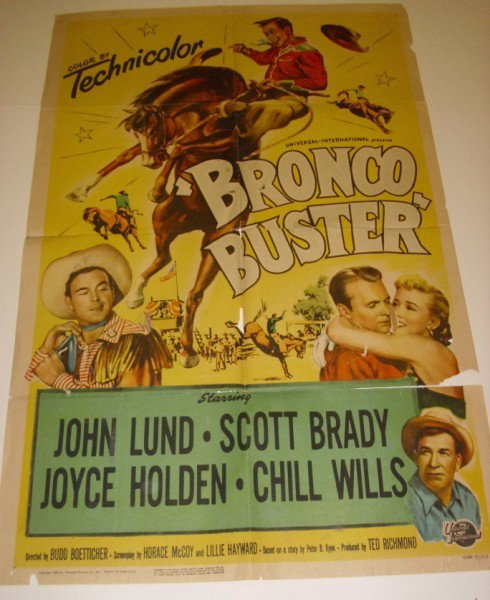 MOVIE POSTER: BRONCO BUSTER MOVIE POSTER STARRING JOHN LUND, SCOTT BRADY, JOYCE HOLDEN, 1952. TEARS; HOLES; STAINS; PICES LACKING; CREASES. 41 INCHES HIGH X 27 INCHES WIDE.