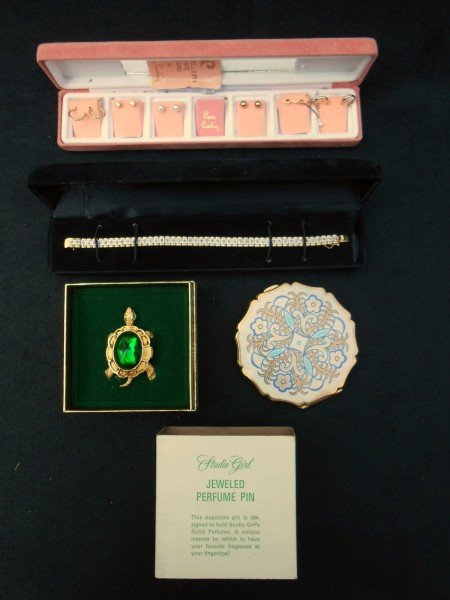 4 PIECES COSTUME JEWELRY: 3 PIECES COSTUME JEWELRY: 1 BRACELET; 1 SET PIERE CARDIN EARRINGS IN BOX- 1 LACKING PEARL; 1 JEWELED TURTLE PERFUME PIN; & 1 COMPACT MARKED "STRATION MADE IN ENGLAND".