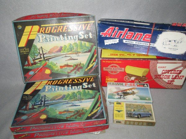 TOYS: 7 VARIOUS TOYS/MODEL KITS INCLUDING 3 1941 PROGRESSIVE PAINTING SETS; HAWK P-6E MODEL KIT; REVELL JAGUAR MODEL KIT; GIANT COVERED WAGON LAMP KIT; AIRLANE KIT. KIT MIGHT NOT BE COMPLETE. USED CONDITION