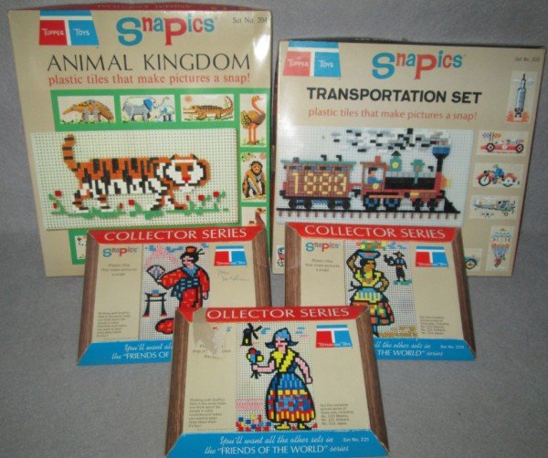 TOYS: 5 TUPPER TOYS PLASTIC TILE SNAP ON SETS INCLUDING ANIMAL KINGDOM; TRANSPORTATION SET. LARGEST MEASURES 14 INCHES X 13 INCHES.