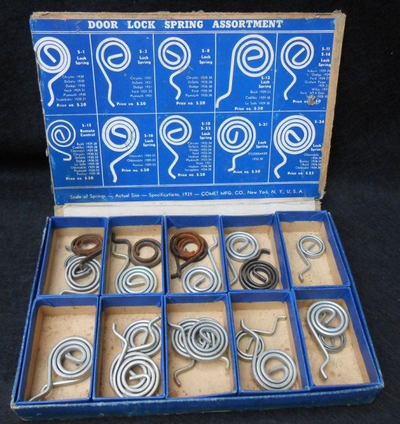 CAR PARTS: 1939 DOOR LOCK SPRING ASSORTMENT BOX WITH SOME SPRINGS. BOX SEPARATING; LACKING EDGES. 8 1/2 INCHES X 5 1/2 INCHES.