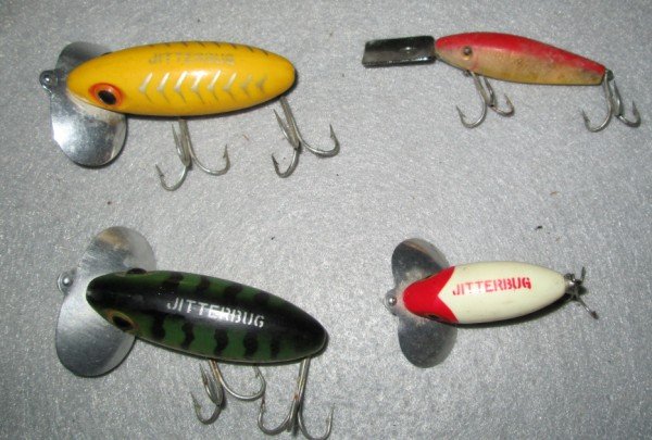 FISHING LURES: 4 FISHING LURES INCLUDING 3 FRED ARBOGAST JITTERBUG & 1 L & S MIRROR LURE SINKER. USED CONDITION.