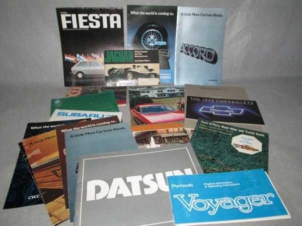 CAR CATALOGS: 20 VARIOUS CAR CATALOGS INCUDING DATSUN; FIESTA; ACCORD; VOYAGER; CHEVROLET; JAGUAR; HONDA CIVIC. USED CONDITION.