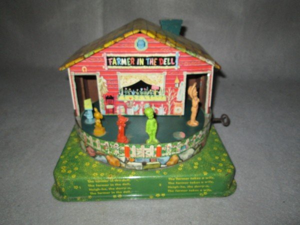 TOY: FARMER IN THE DELL WIND UP TOY, 1953. SCRATCHES; LACKING FIGURE; DENT.