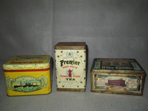 TINS: 3 TINS INCLUDING PREMIER PERRI WALLA ORANGE PEKOE TEA; OCEANIC CUT PLUG; THE PUBLIC BENEFIT BOOT COMPANY. USED CONDITION; SCRATCHES; RUST; DENTS. LARGEST MEASURES 6 1/2 INCHES X 4 INCHES.