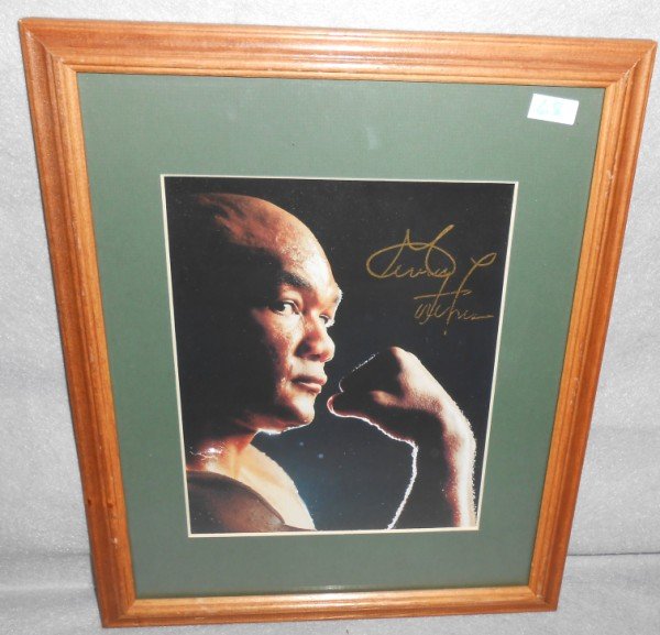 PRINT: GEORGE FOREMAN PHOTO PRINT SIGNED. TEAR IN PRINT. 15 1/2 INCHES X 12 INCHES.