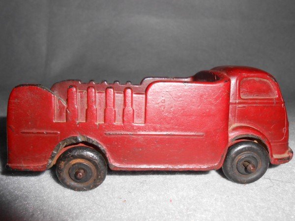TOY: AUBURN RUBBER CORP. TOY TRUCK. PIECE LACKING; SCRATCHES. 5 1/2 INCHES X 2 INCHES.