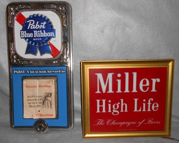 BEER ADVERTISING: 2 BEER ADVERTISING ITEMS INCLUDING MILLER HIGH LIFE LIGHT- WORKING; PABST BLUE RIBBON BEER 1979 CALENDAR. PAPER TORN; CORNERS CRACKED; SCRATCHES. LARGEST MEASURES 18 INCHES X 9 INCHES.