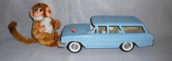 TOYS: 2 TOYS INCLUDING BUDDY L STATION WAGON; & AVLON INC MONKEY STUFFED ANIMAL. WINDOW BROKE; SCRATCHES; STICKER; STAINS; WEAR. LARGEST MEASURES 14 1/2 INCHES X 5 1/2 INCHES.