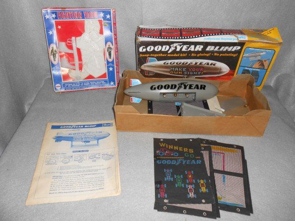 TOYS: TOY LOT INCLUDING REVELL GOODYEAR BLIMP MODEL KIT; & MEGO FIGHTING YANK GI JOE DOLL CLOTHES. USED CONDITION; LACKING PIECES; STAINED. 18 INCHES X 4 INCHES.