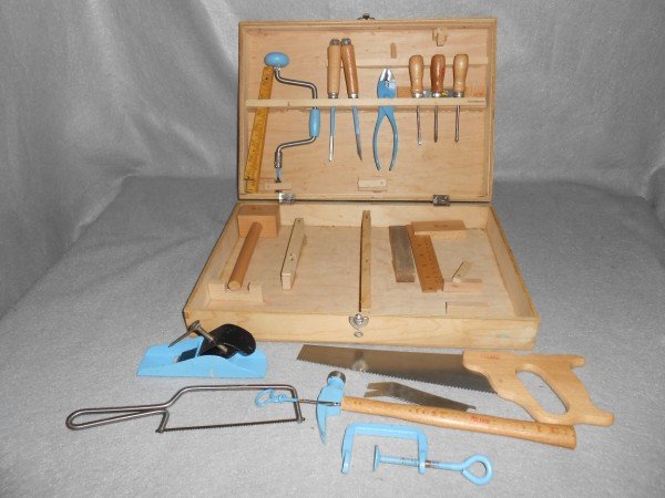 TOOL KIT: CHILDS TOOL KIT MADE IN POLAND. POSSIBLE NOT COMPLETE. 11 INCHES X 16 INCHES.
