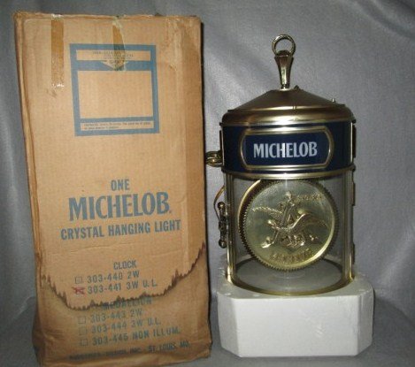 BEER ADVERTISING: LARGE MICHELOB REVOLVING LIGHTED CLOCK BEER ADVERTISING. MINT UNUSED IN ORIGINAL BOX. WORKING. 12 1/2 INCHES X 24 1/2 INCHES.