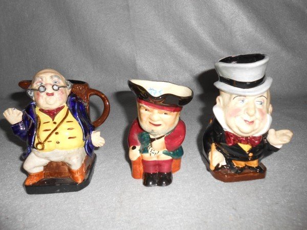 TOBY JUGS/CHARACTER MUGS: 3 TOBY JUGS INCLUDING MR. PICKWICK IRONSTONE; STAFFORDSHIRE; IRONSTONE MR. MUGABE. LARGEST MEASURES 5 1/2 INCHES X 3 INCHES.