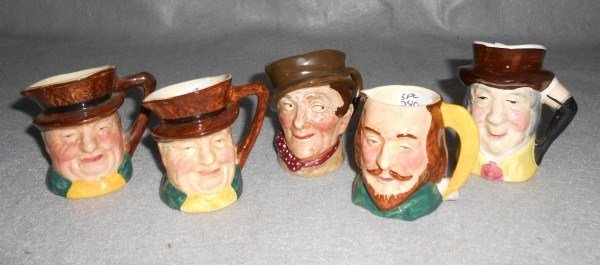 TOBY JUGS/CHARACTER MUGS: 5 TOBY JUGS INCLUDING SANDLAND WARE; MR. WOLF KELSBORO WARE; ROYAL DOULTON. LARGEST MEASURES 3 INCHES X 2 INCHES.