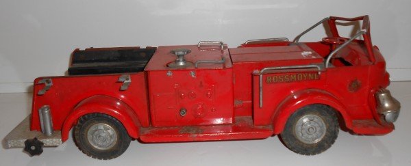TOY: 1950'S MODEL TOYS FIRE TRUCK. LACKING PIECES; USED CONDITION. 18 INCHES X 5 1/2 INCHES X 7 INCHES.