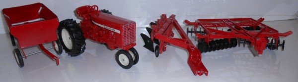 TOY: 1970'S 4 PIECE ERTL TRACTOR SET. USED CONDITION. 8 INCHES X 5 INCHES X 4 INCHES.