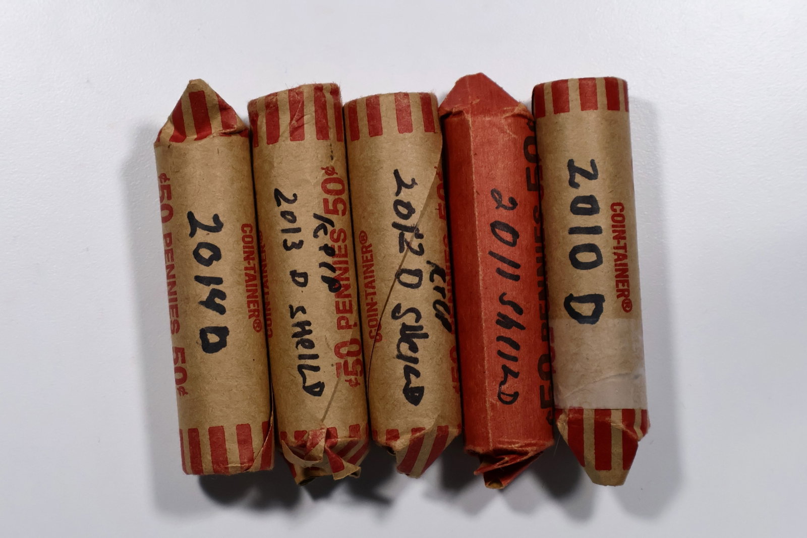 5 Lincoln Cents Penny 2010-2014 Unc Rolls: (#OH25) Bid is for all 5 rolls. Appear to be uncirculated and bright. Unsearched as consigned. OVERSIZED