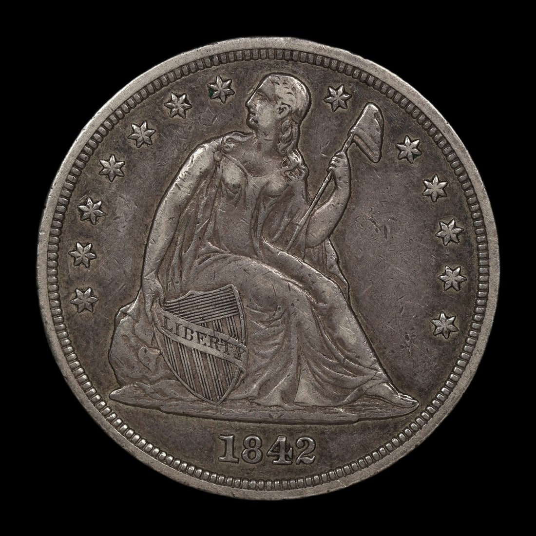 1842 Seated Liberty Dollar XF ULTRA RARE: Extremely tough series to collect. These are hardly ever on the market above fine condition. The Lampasas Collection features a near complete run of this series! This example is well struck and very