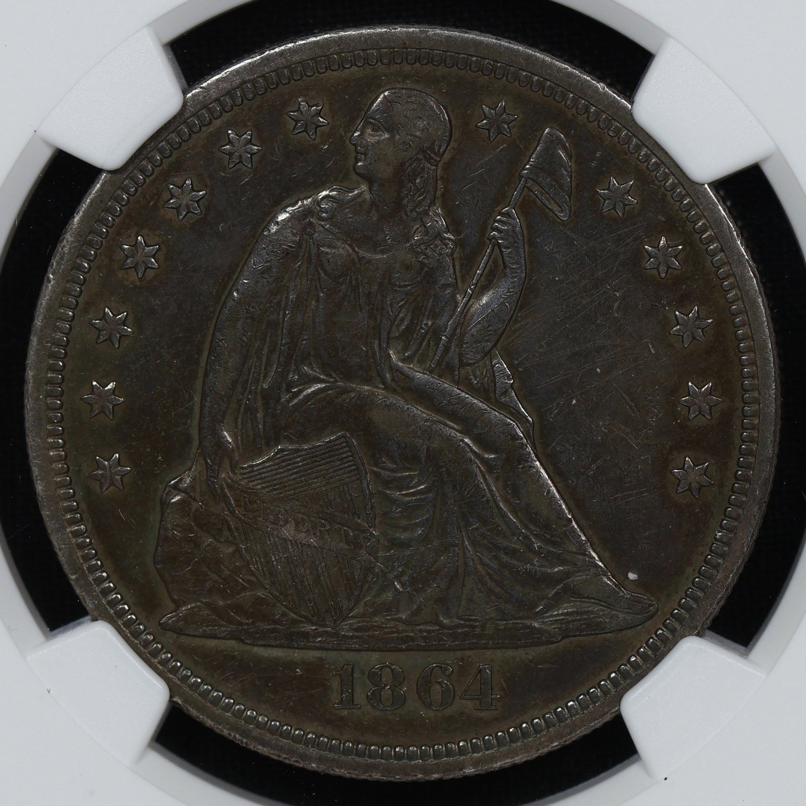 1864 Seated Liberty Dollar XF Details CIVIL WAR: A much better date with very few even existing at NGC. Classic rustic even toning that accompanies circulated coins from this era. XF is fairly harsh given the significant detail.
