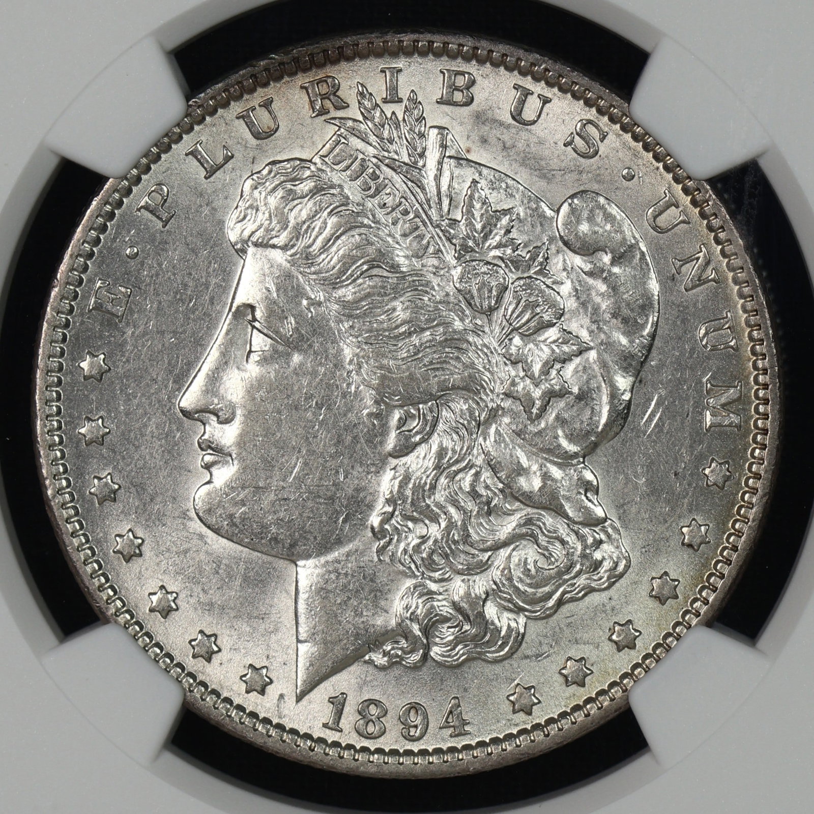 1894 Morgan Silver Dollar NGC AU-55 KEY DATE: A truly RARE coin. One of the toughest coins in all of the Morgan dollar series. This example white and glimmers even in low light. Has NOT been to CAC!