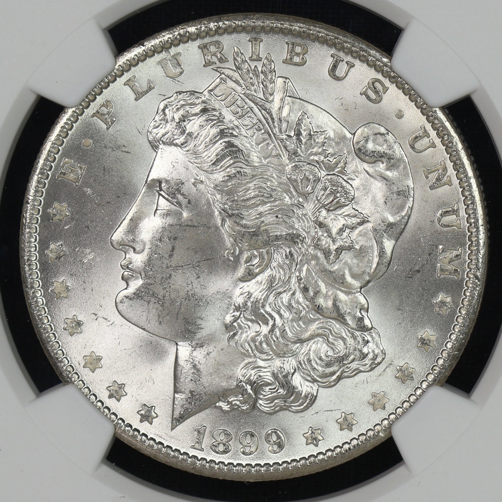 1899 O Morgan Silver Dollar NGC MS-63: Incredibly clean, flashy and well struck for a 63.